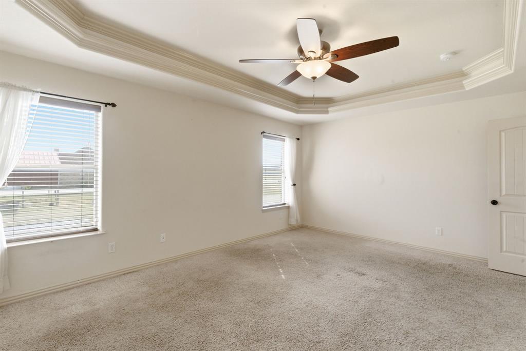 119 Cooperstown Drive Springtown, TX 76082 - Photo 15 of 33 a view of an empty room with a ceiling fan and window