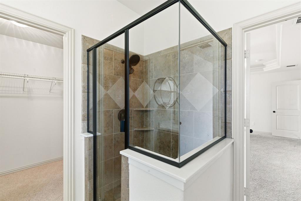119 Cooperstown Drive Springtown, TX 76082 - Photo 16 of 33 a bathroom with a glass shower door and mirror