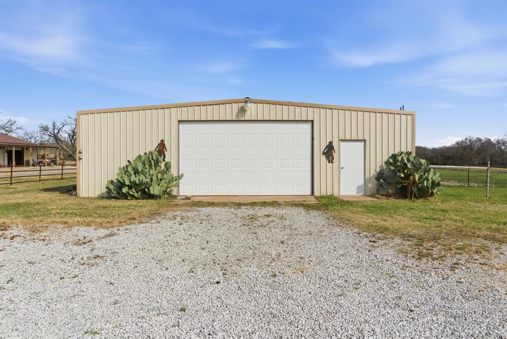 119 Cooperstown Drive Springtown, TX 76082 - Photo 2 of 33 a view of backyard space and garage