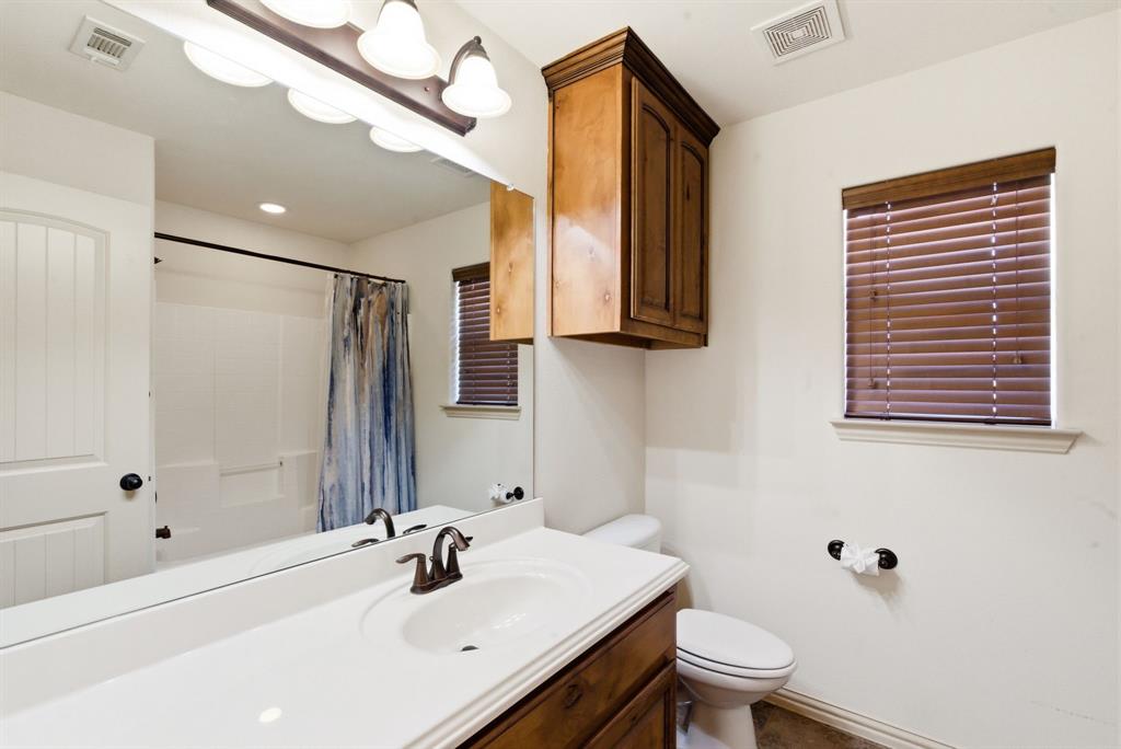 119 Cooperstown Drive Springtown, TX 76082 - Photo 21 of 33 a bathroom with a sink a toilet and shower