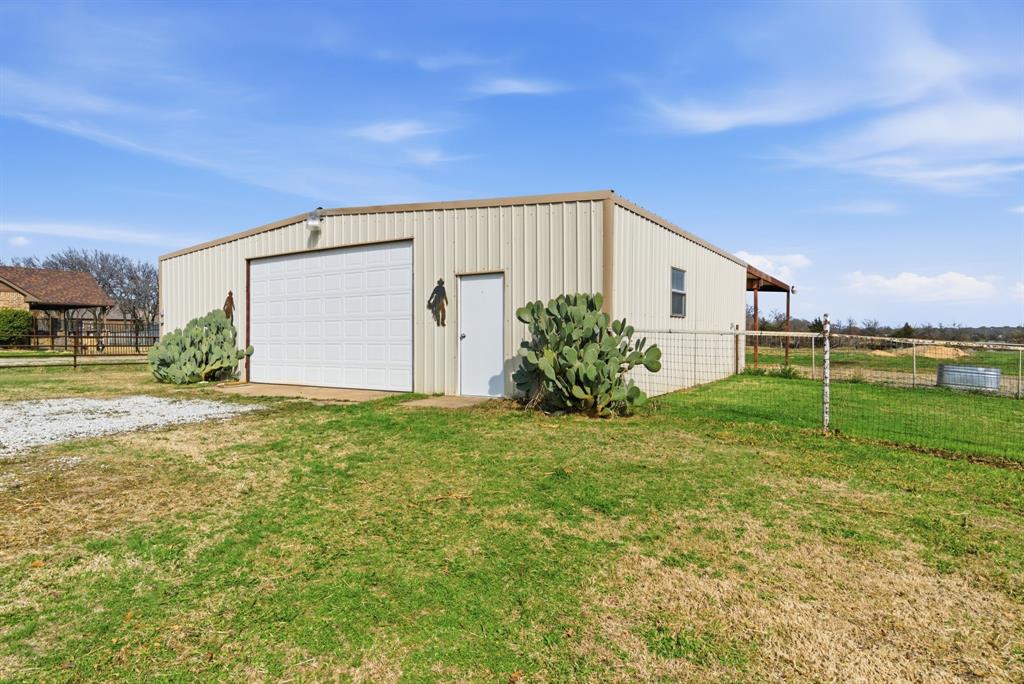 119 Cooperstown Drive Springtown, TX 76082 - Photo 28 of 33 a view of a house with backyard and garden