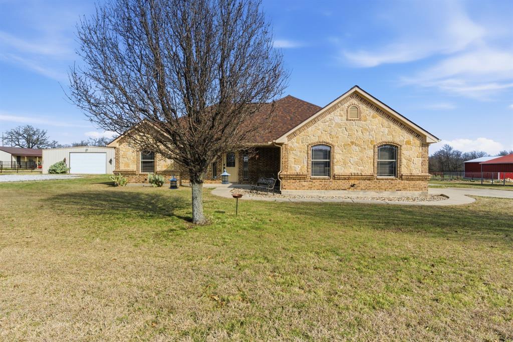 119 Cooperstown Drive Springtown, TX 76082 - Photo 32 of 33 a front view of a house with a yard