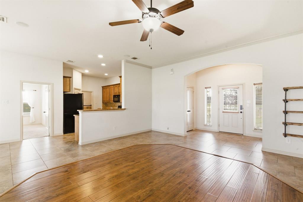 119 Cooperstown Drive Springtown, TX 76082 - Photo 8 of 33 a view of a kitchen with wooden floor and a kitchen