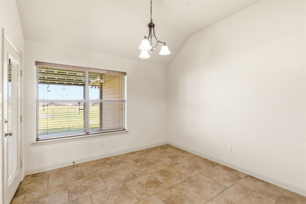 119 Cooperstown Drive Springtown, TX 76082 - Photo 10 of 33 a view of an empty room with a window