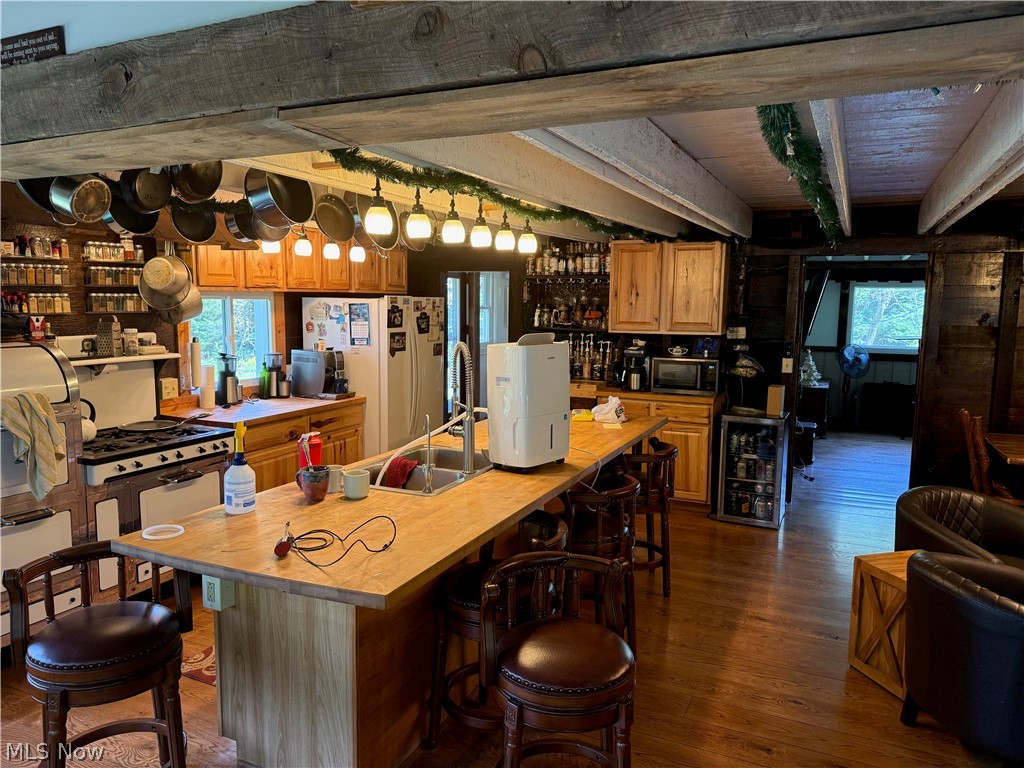 11811 Gaston Road Rogers, OH 44455 - Photo 25 of 38 Enjoy your time inside this cozy, functional, and equipped log cabin! You've already got the important utilities like electric, geo-thermal heat, a septic system installed 6 years ago, and private well water.