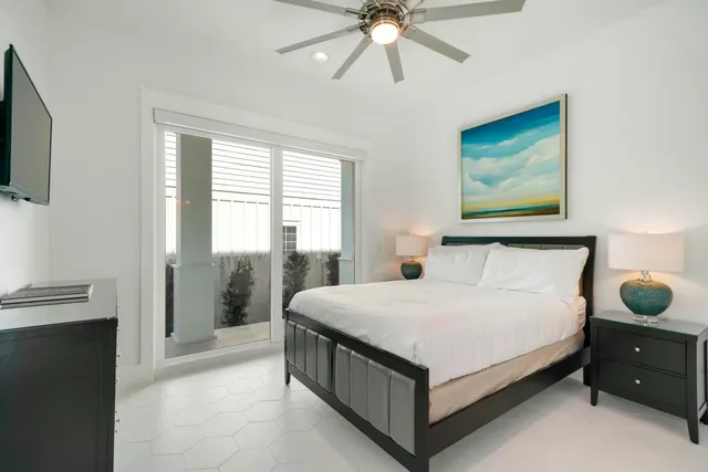 a bathroom with a toilet sink a mirror and shower