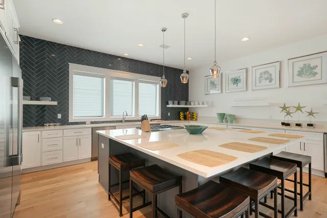 a kitchen with stove and cabinets