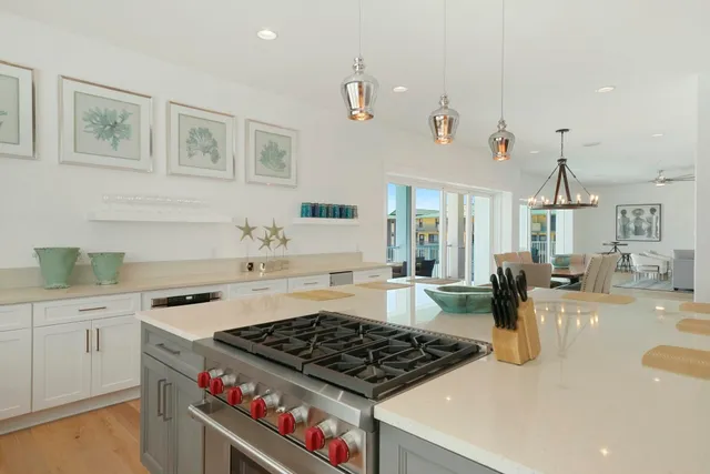 a bedroom with a bed and a flat tv screen on dresser