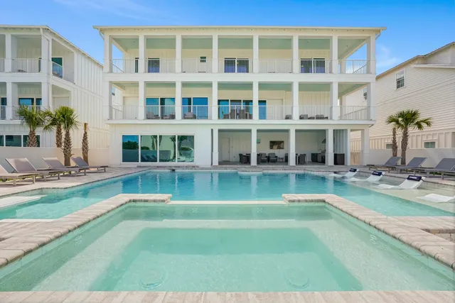 a view of an apartment with a swimming pool