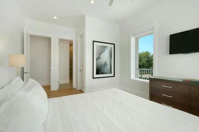a bathroom with a double vanity sink mirror double shower and a toilet