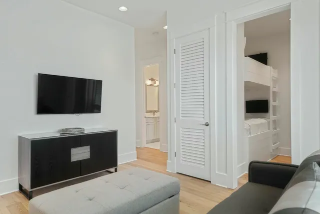 a bedroom with a bed and a television