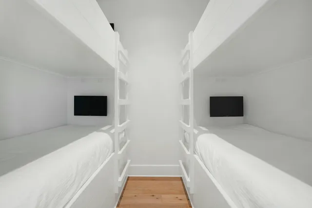 a bedroom with a bed and ceiling fan