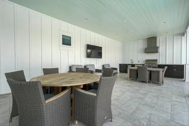 an aerial view of a chairs and table on the terrace