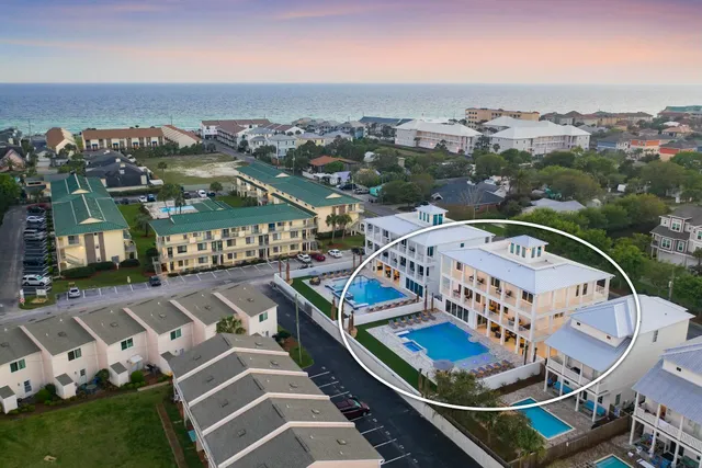 an aerial view of a house with a lake view