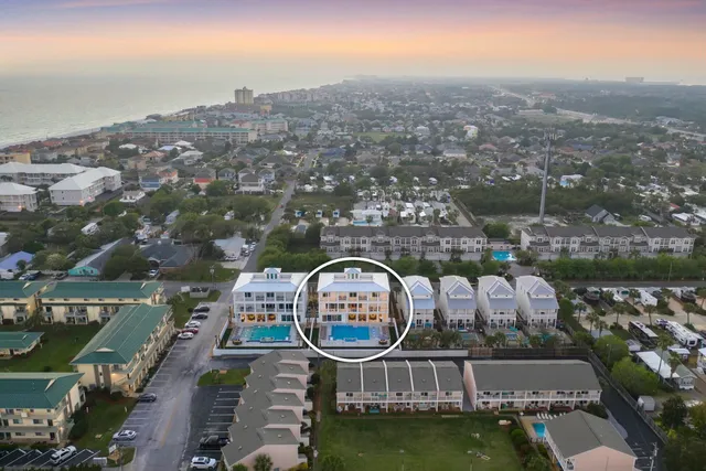 an aerial view of a house with a ocean view
