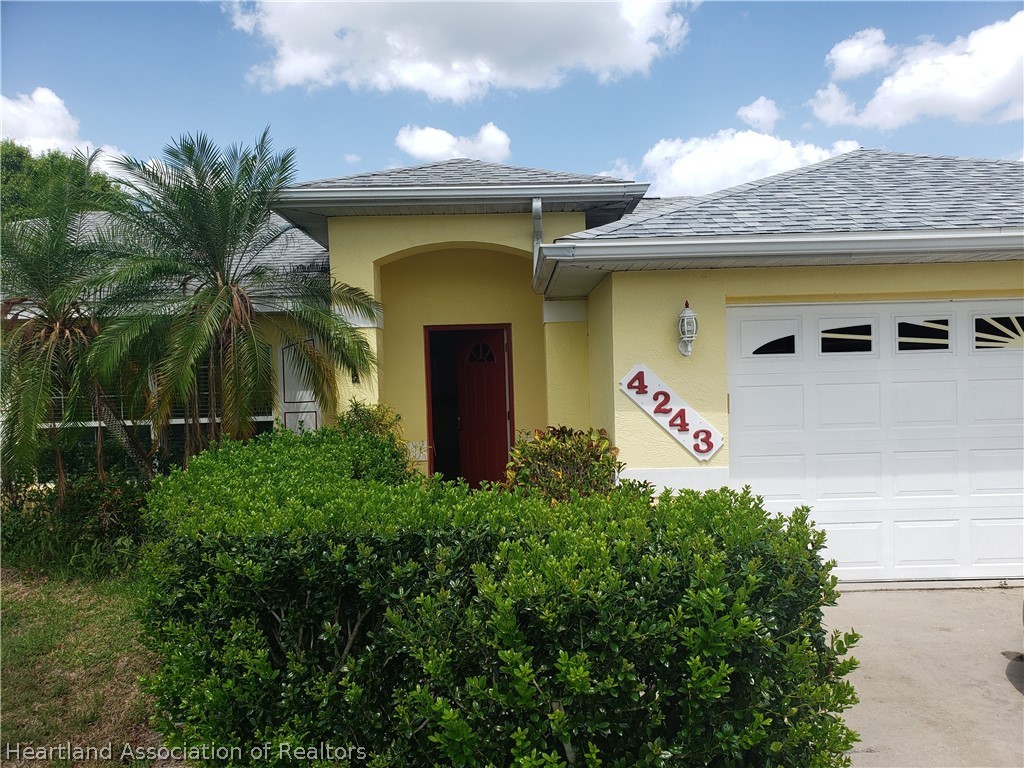 4243 Mandarin Road Sebring, FL 33875 - Photo 1 of 12 a front view of a house with plants