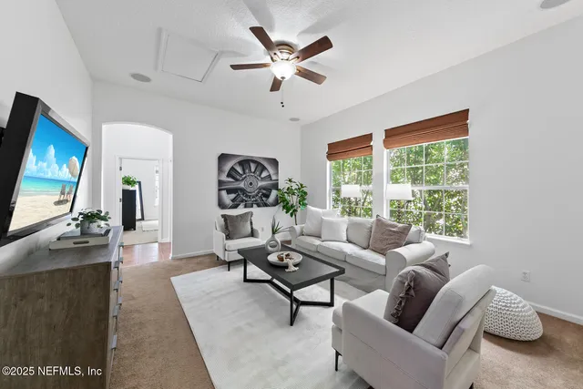 a view of a chair and table in the balcony