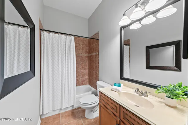 a view of a house with a large window and a yard