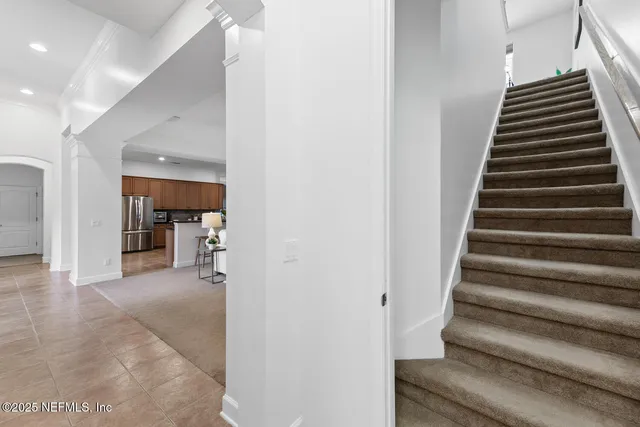 an aerial view of a houses with yard