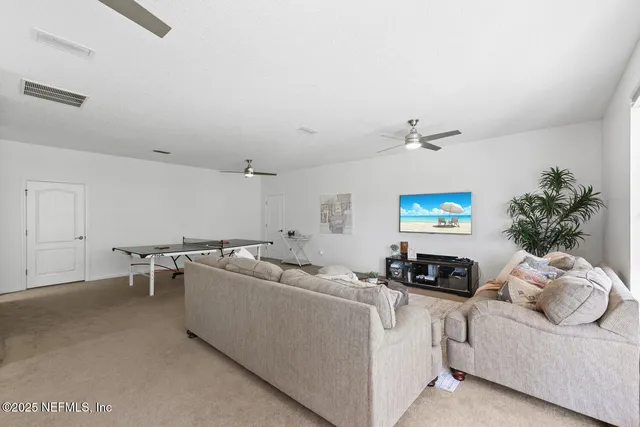 a view of multiple houses with a yard