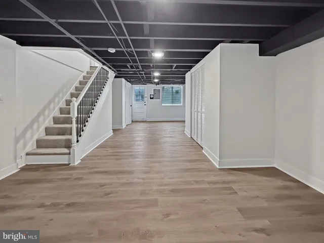 a view of an empty room with stairs