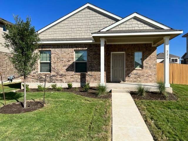 221 Arabian Colt Drive Georgetown, TX 78626 - Photo 1 of 36 a front view of a house with a garden