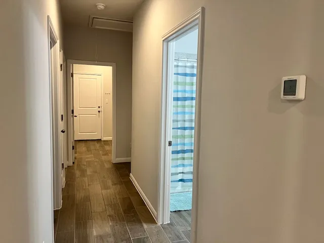 a view of an empty room with a window