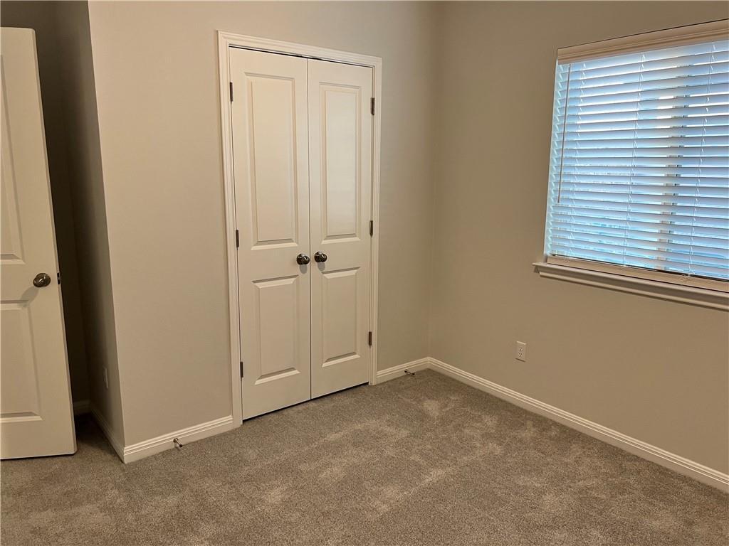221 Arabian Colt Drive Georgetown, TX 78626 - Photo 21 of 36 an empty room with windows