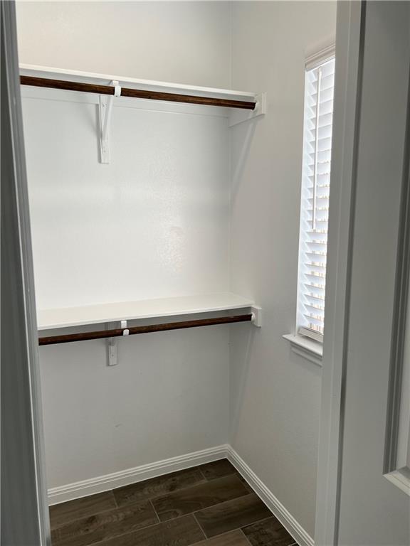 221 Arabian Colt Drive Georgetown, TX 78626 - Photo 4 of 36 a view of a room with wooden floor and fan