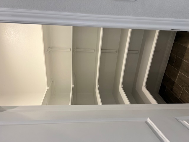 221 Arabian Colt Drive Georgetown, TX 78626 - Photo 9 of 36 a view of walk in closet with empty racks