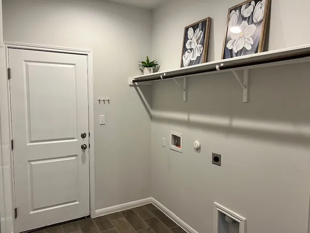 an empty room with wooden floor chandelier fan and windows