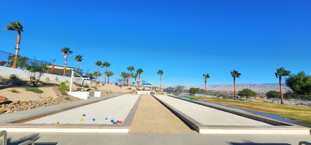 a view of a swimming pool with a lounge chairs