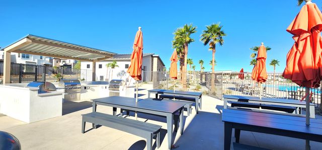 a view of a street with palm trees