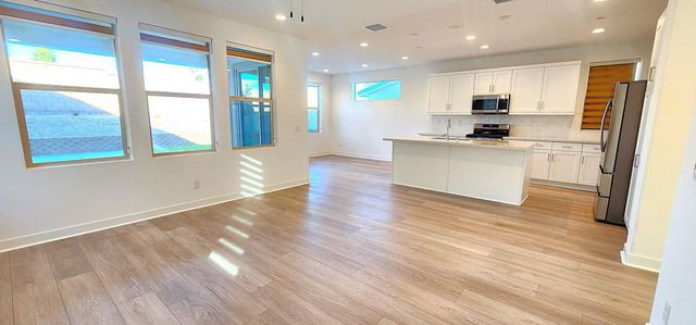 a view of kitchen with cabinets and wooden floor