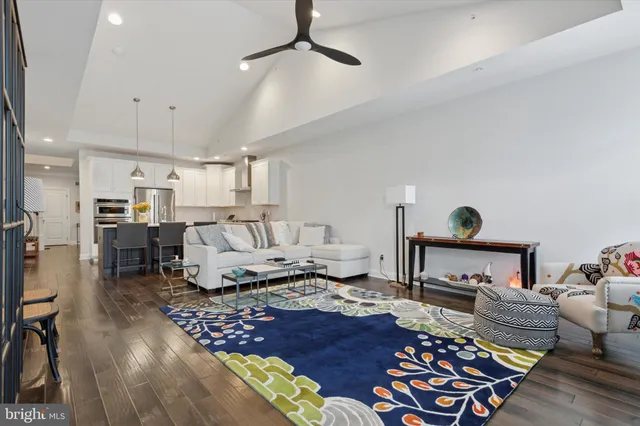 a living room with furniture and a rug