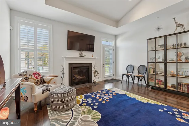 a living room with furniture fireplace and flat screen tv
