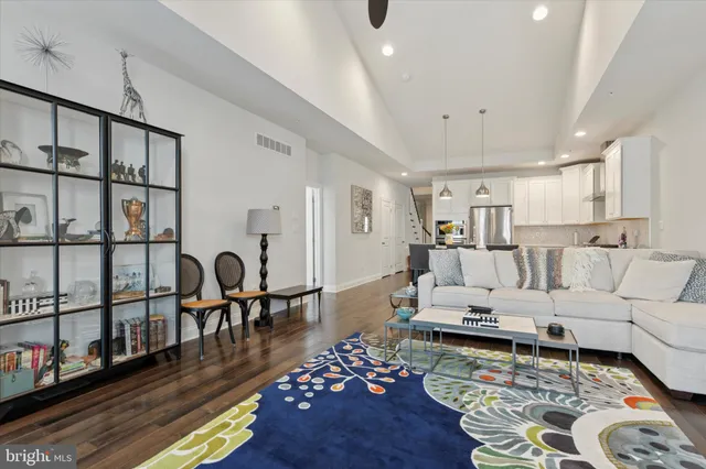 a living room with furniture or couch and a wooden floor