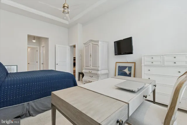 a bedroom with a bed and a television