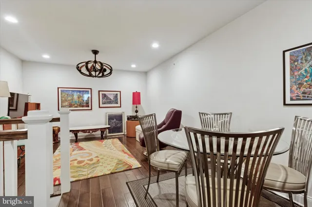 a view of a room with furniture and wooden floor