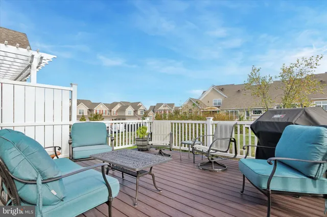 a view of a balcony with furniture