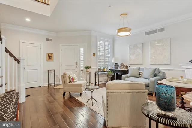 a living room with furniture a window and a table