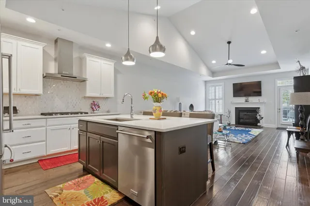 a kitchen with a sink stainless steel appliances and cabinets