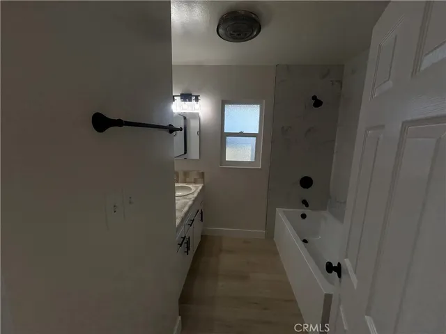 a bathroom with a sink and shower