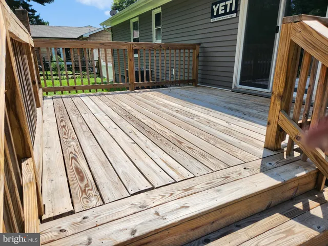 a view of a balcony with wooden floor