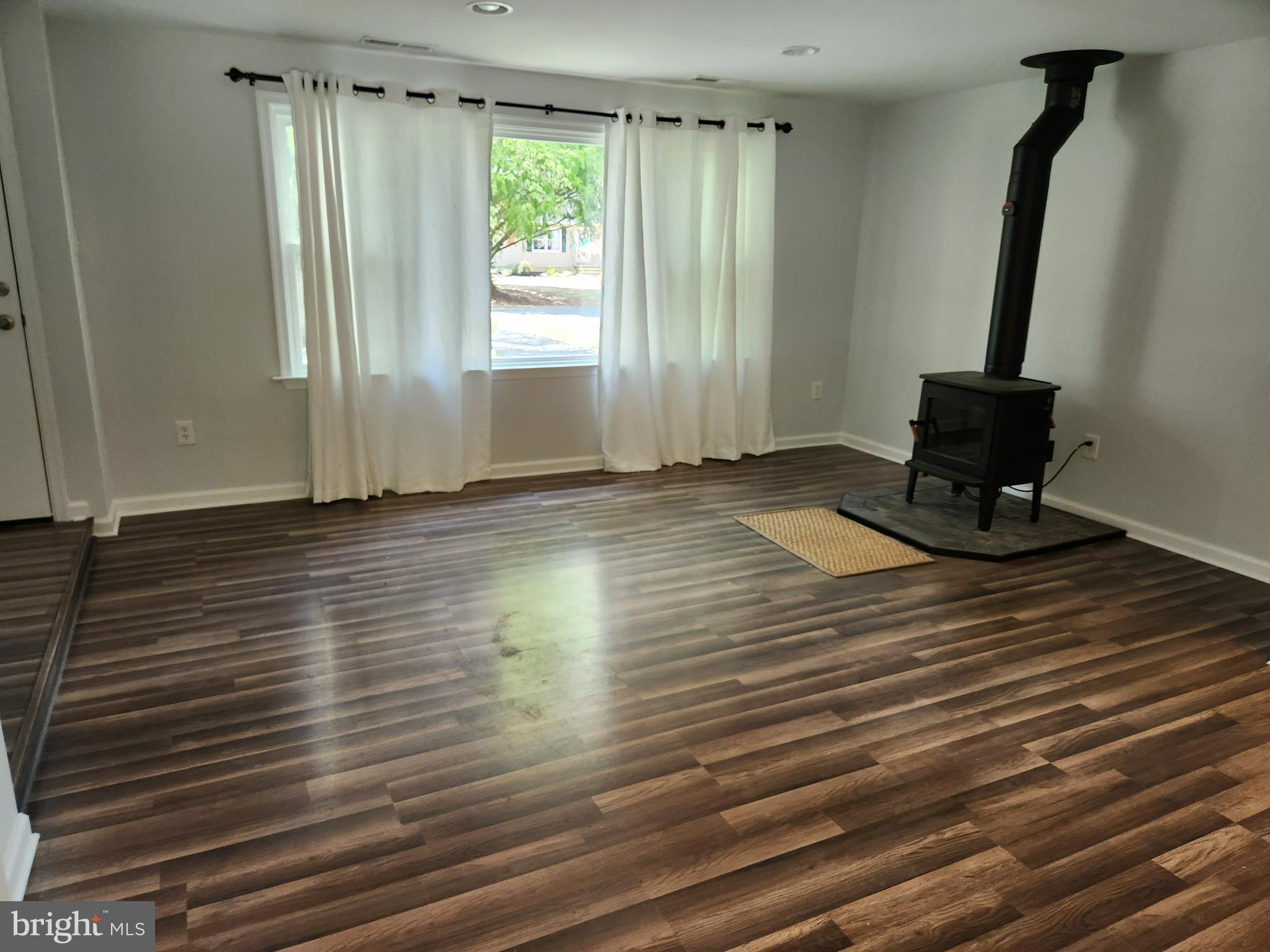 908 May Lane Stevensville, MD 21666 - Photo 9 of 17 Living room with stove for decoration only