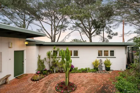 a bedroom with bed and cabinet