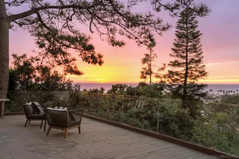 a view of a large building with a mountain in the background