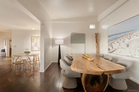 a dinning room with furniture and wooden floor