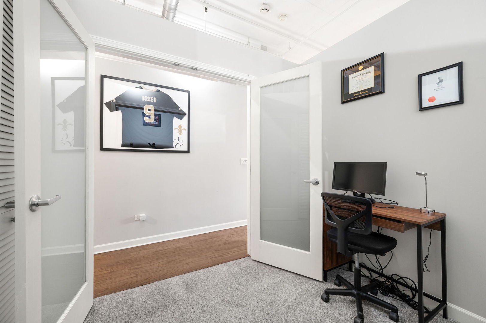 1301 West Madison Street, Unit 207 Chicago, IL 60607 - Photo 11 of 17 a view of a workspace with furniture and a window