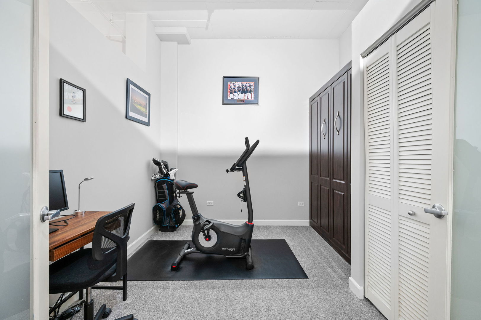 1301 West Madison Street, Unit 207 Chicago, IL 60607 - Photo 10 of 17 a room with gym equipment and windows